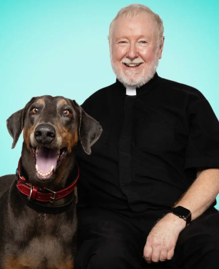 Rector Andrew Heyes of St. Clement’s Episcopal Church with his Doberman, Humphrey